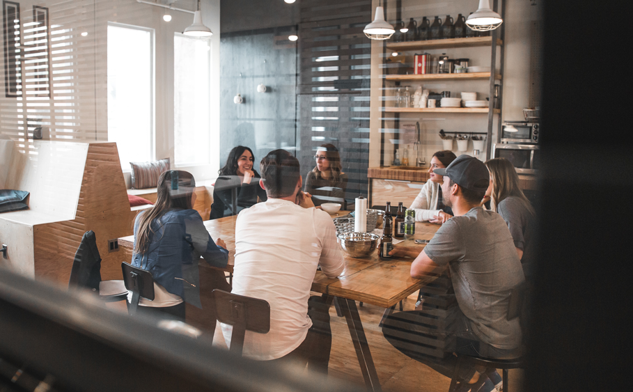 Colleagues gathered round the meeting table