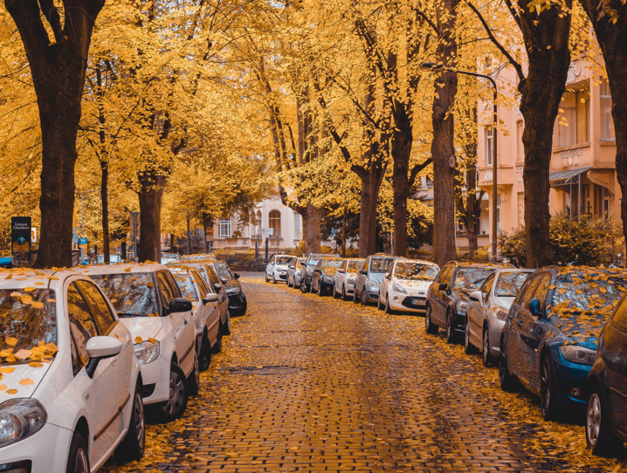 Cars pavement parking on a small street