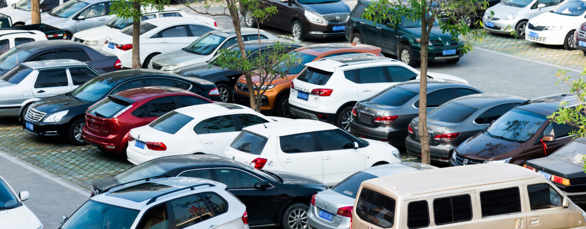 A busy car park with parking abuse