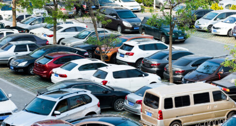 A busy car park with parking abuse