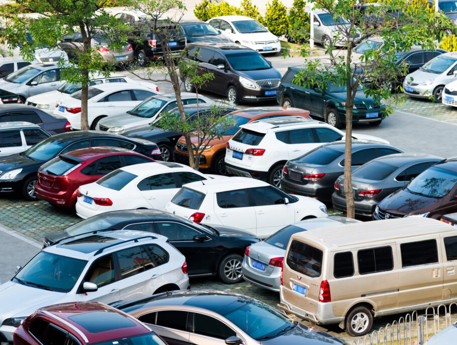 A busy car park with parking abuse