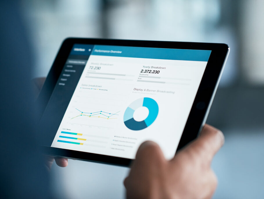 An iPad displaying a report of data and figures