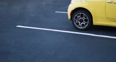 Yellow Car parked in a parking space