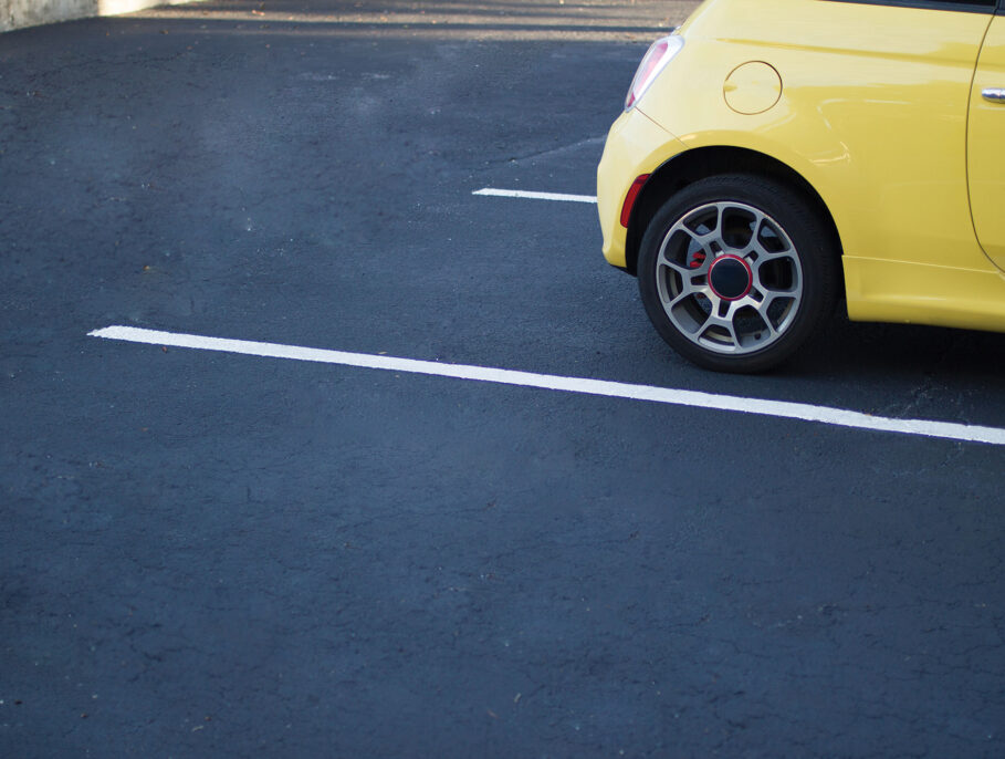 Yellow Car parked in a parking space