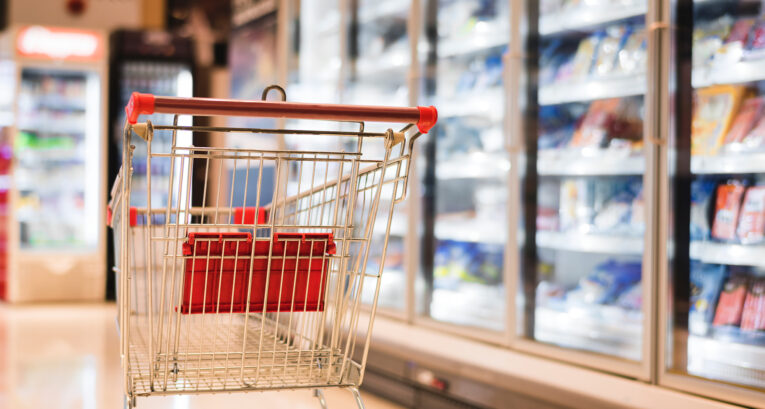 Supermarket trolley alone in the frozen aisle