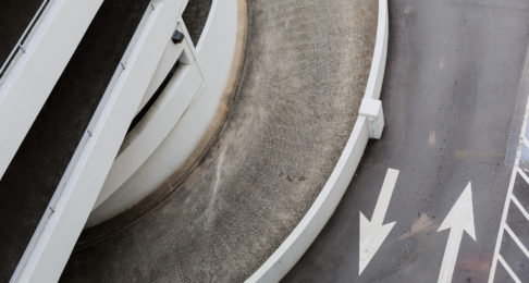 Double arrows on the road of a multi-storey car park