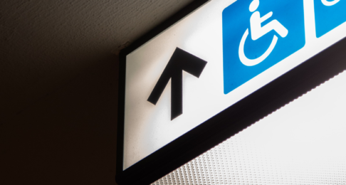 Illuminated sign showing where the wheelchair access is