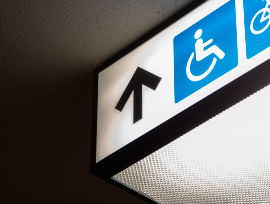 Illuminated sign showing where the wheelchair access is