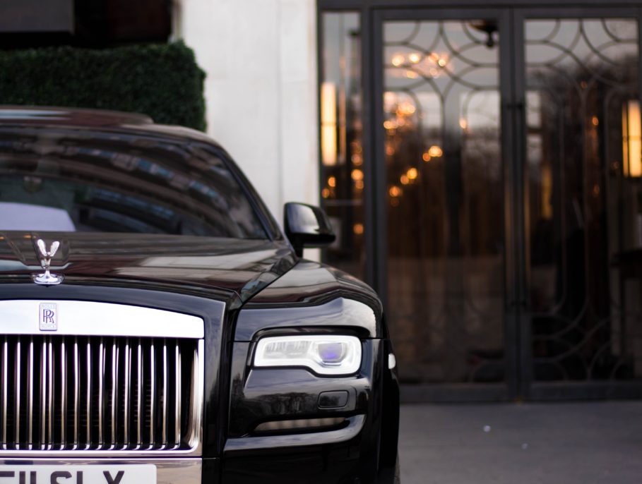 A Car parked up outside a hotel entrance