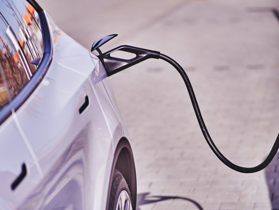 Electric car hooked up to charging port