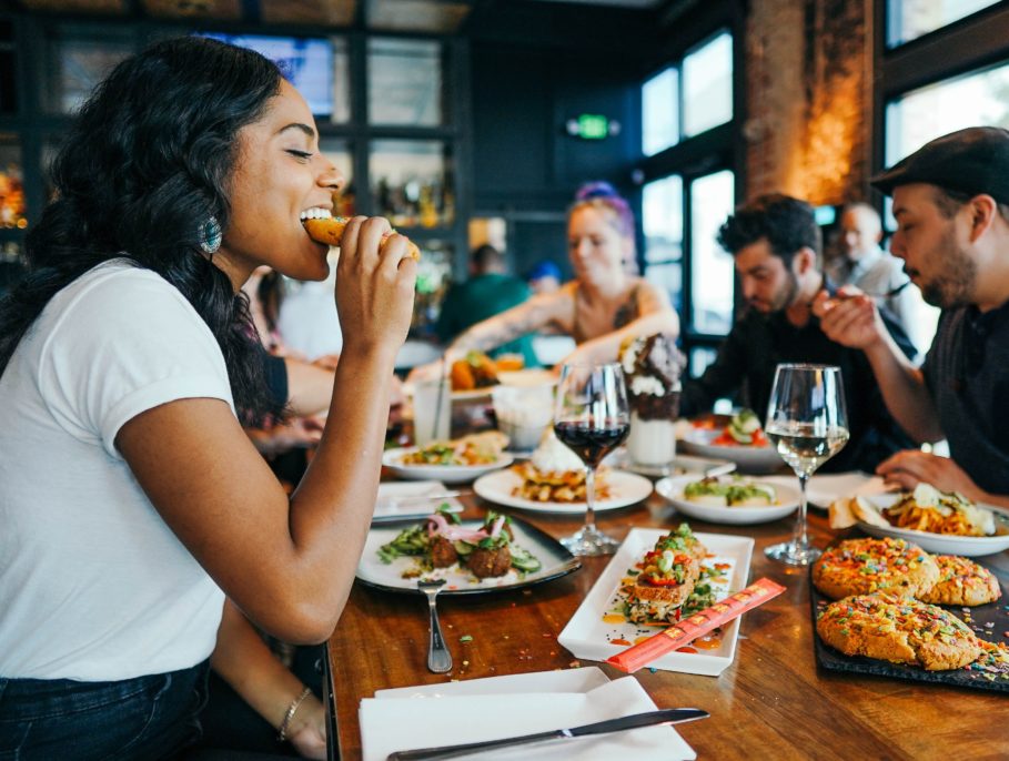 Woman tucking into food at a local restaurant