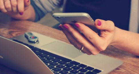 woman working with phone in hand