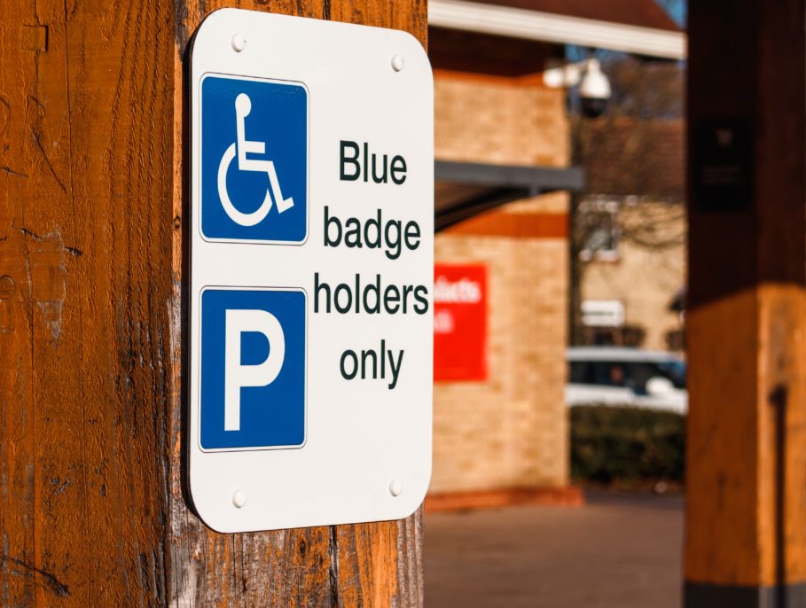 A small sign on a car park