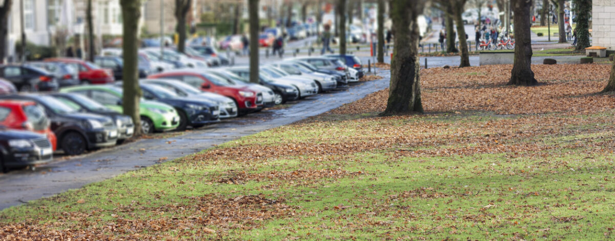 Blurry image of cars parked in a parking lot