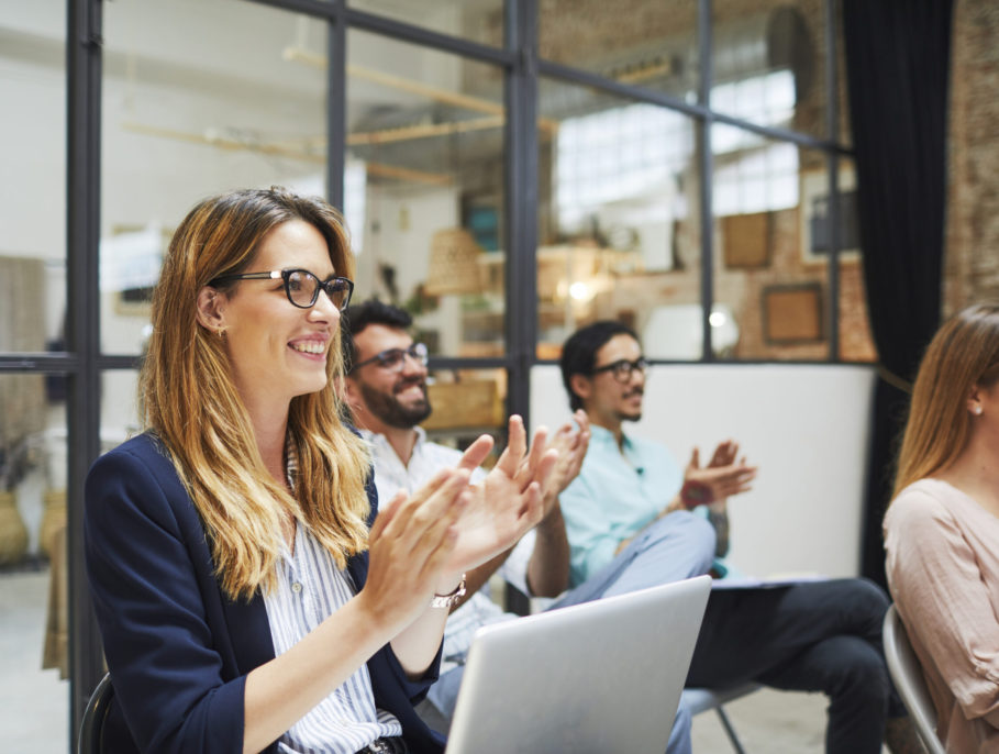 Group of people listening to a presentation speech.