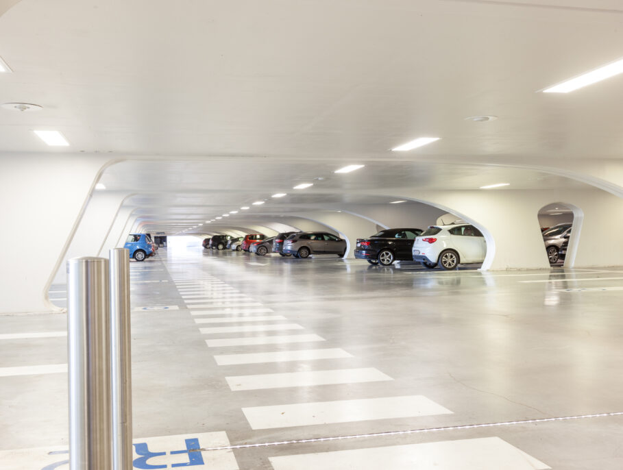 Underground park of a mall with columns and ventilation ducts