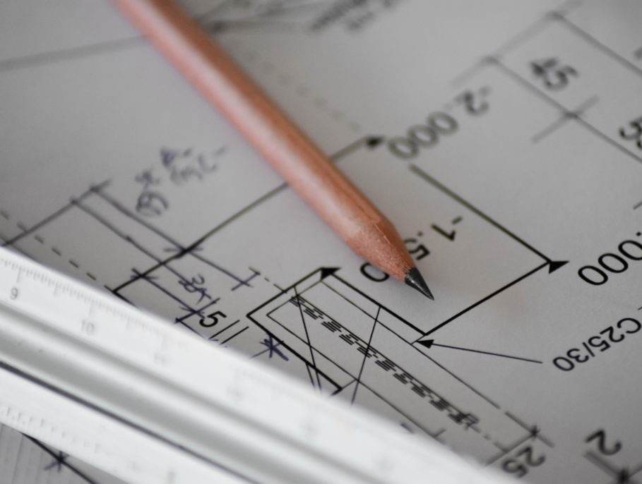 Engineering paper with a pencil resting on it