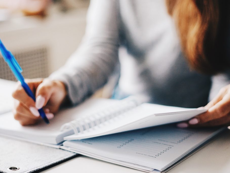 Office worker writing in her notebook